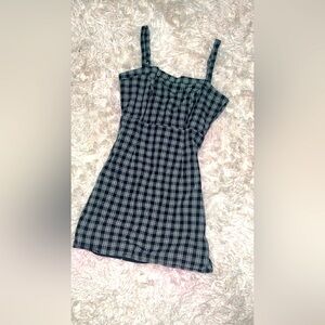 Black and white plaid fitted mini dress.